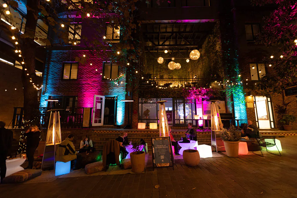 A glowing outdoor event setup during a night event