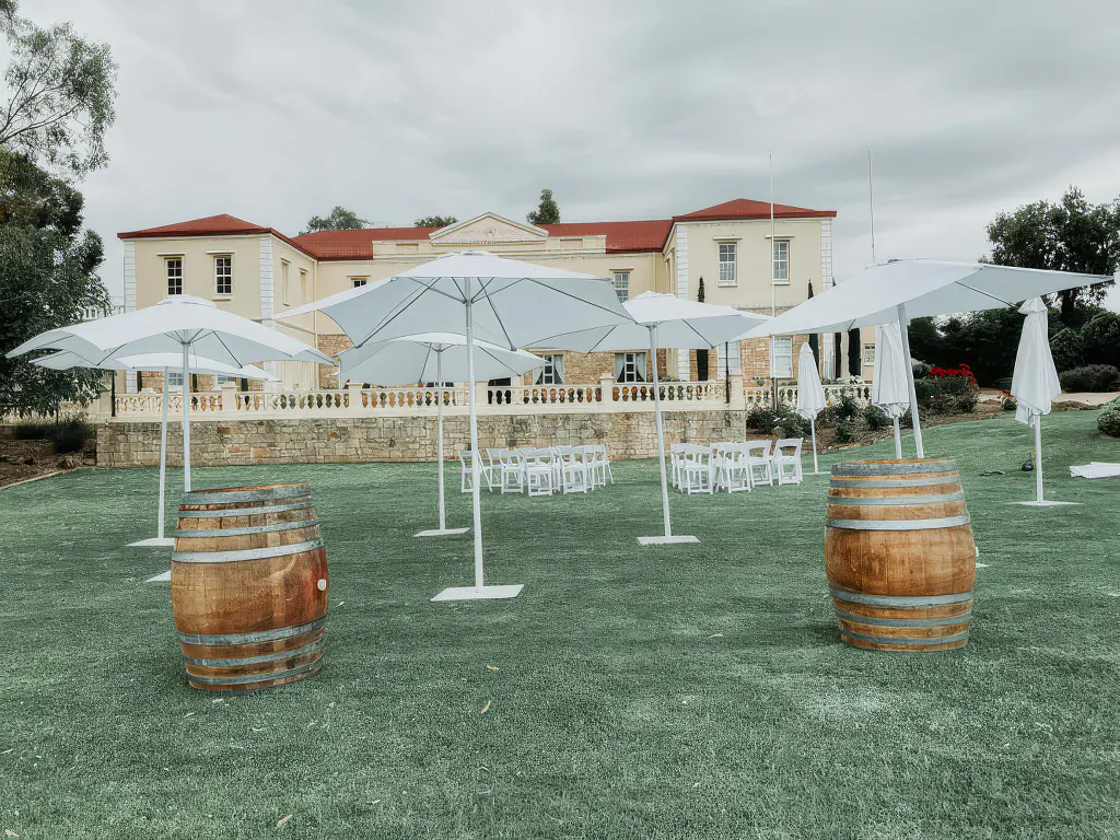 Outdoor umbrellas at an outdoor wedding reception