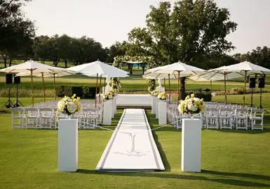 Outdoor wedding ceremony with shaded seating