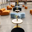 Apollo daybeds and ottomans with Atlas coffee tables in a large event lounge