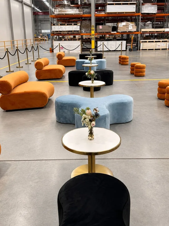 Apollo daybeds and ottomans with Atlas coffee tables in a large event lounge