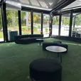 Large black velvet Apollo ottomans used as lounge seating at an event