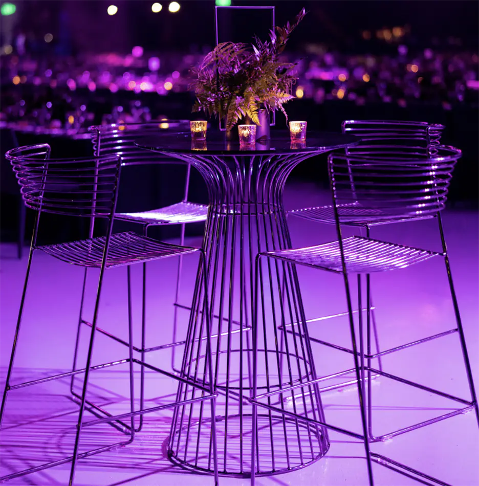 Gun metal Avery bar stools arranged at a high bar at a brand activation event