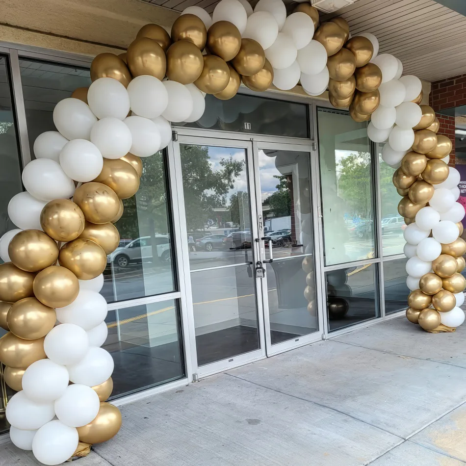 A beautiful golden white balloon arch for hire
