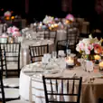 Round black and white plastic tablecloths for banquet tables.
