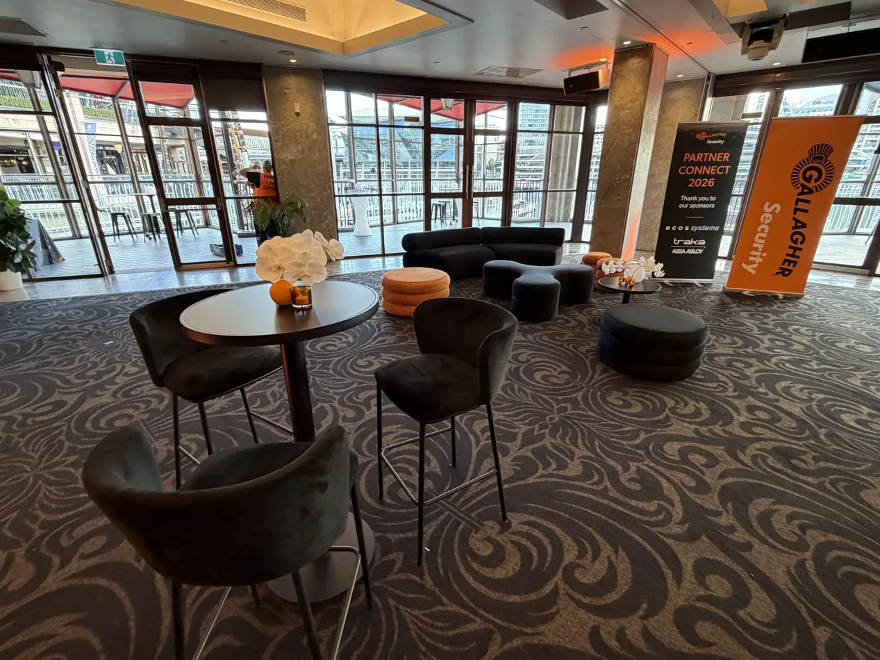 Black Apollo lounge furniture with Sienna ottomans and black Atlas coffee tables in a conference lounge
