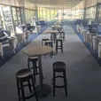 Black Atlas bar table with black Ghost stools in a modern event setting