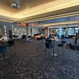Black Atlas bar tables with black velvet bar stools at an indoor event