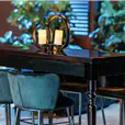 Black velvet bar stools arranged at a high bar at a corporate cocktail event