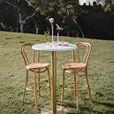Blonde bentwood bar stool with curved back rest in natural oak timber grain finish
