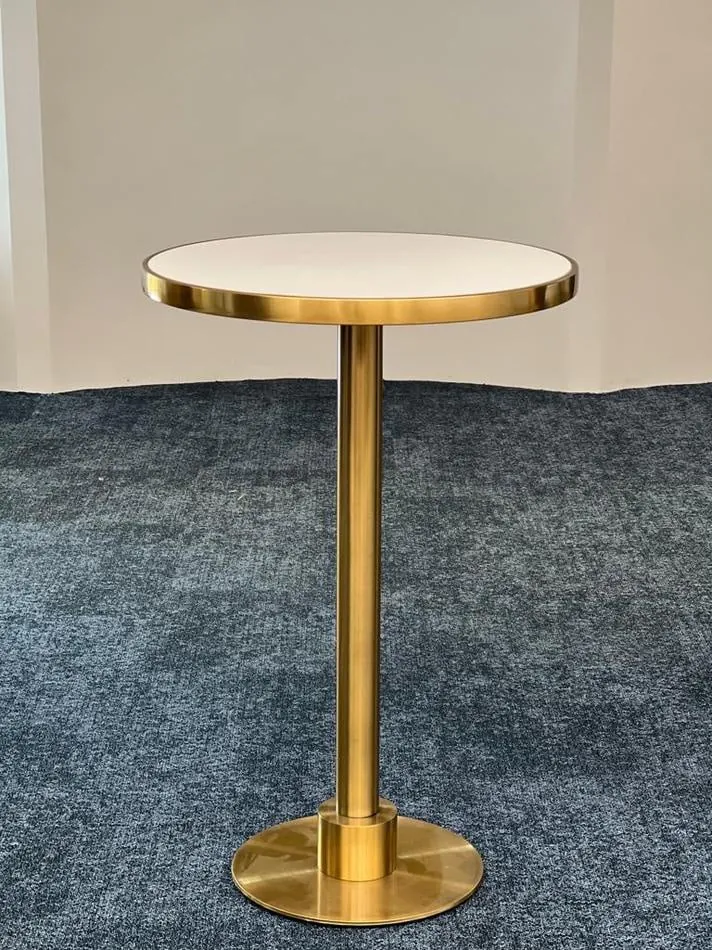 A brass cocktail bar table hire with a white top.