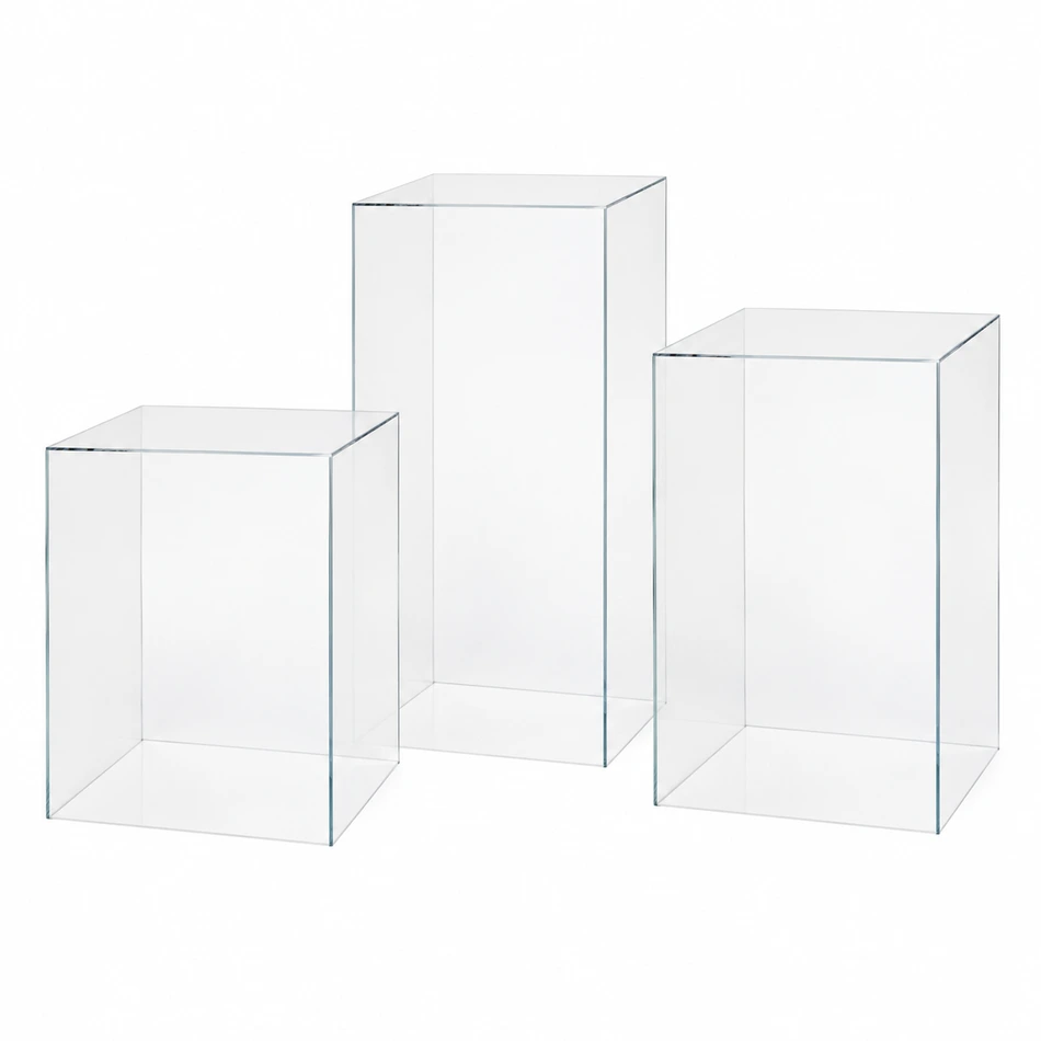 Three clear square acrylic plinths in staggered 40cm, 50cm and 60cm heights
