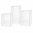 Three clear square acrylic plinths in staggered 40cm, 50cm and 60cm heights
