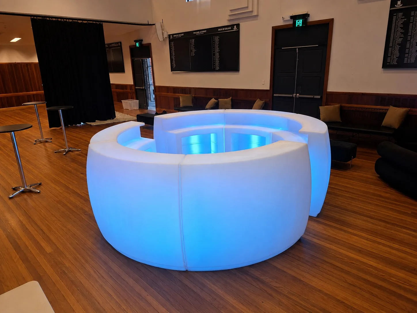 Curved LED glow bar counter glowing white at a function