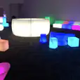 A room full of vibrant and colorful stools and tables.