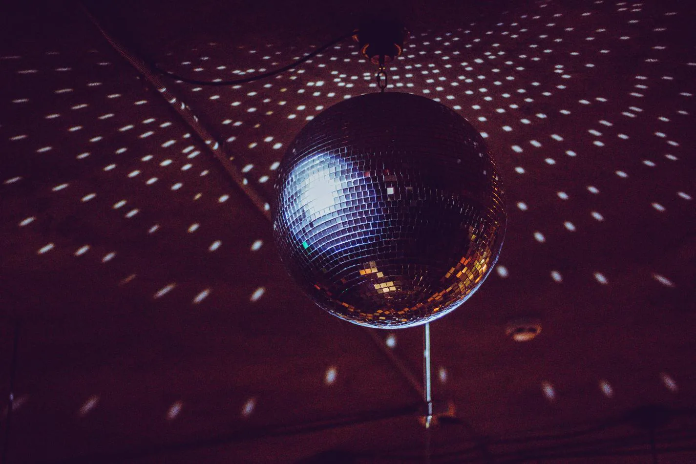 A spinning disco ball with lights