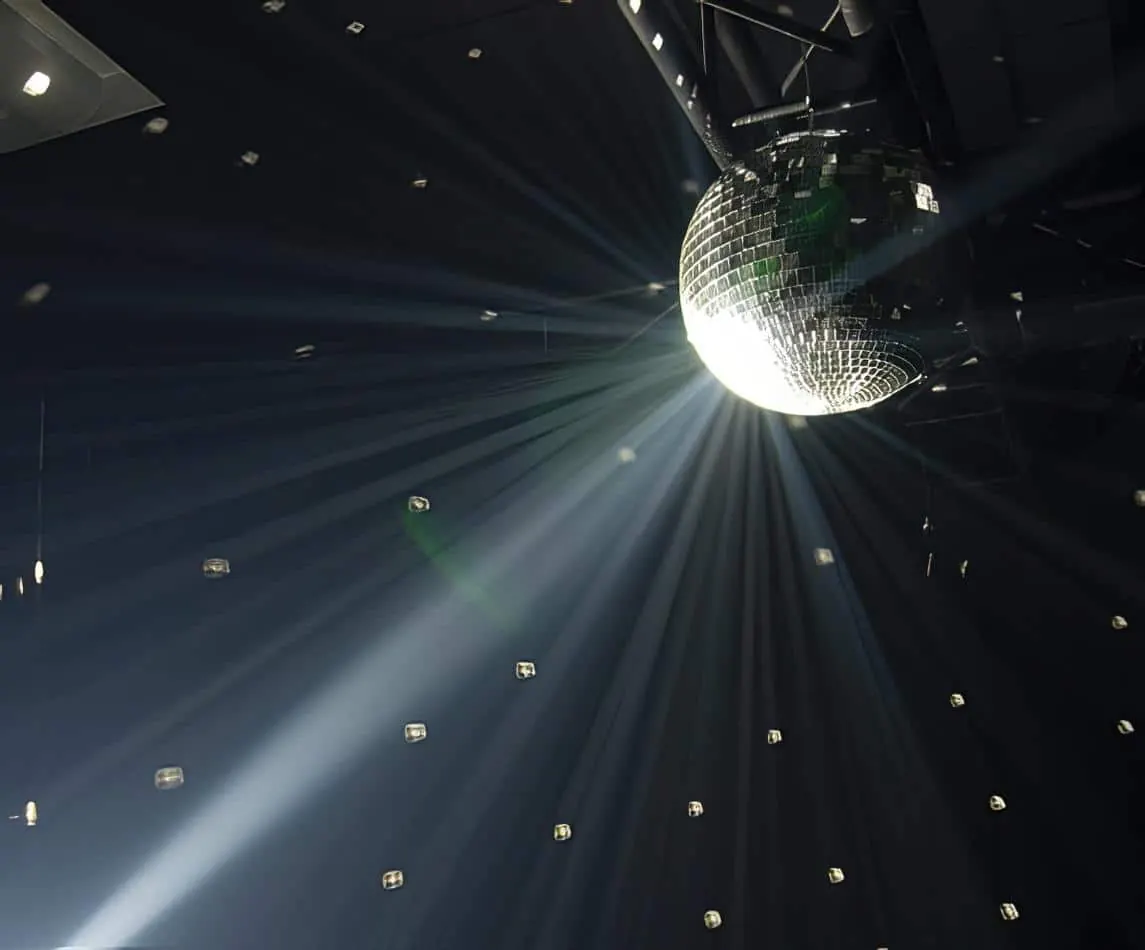 A disco ball with smoke and lighting