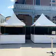 Two fete stalls in front of a building.