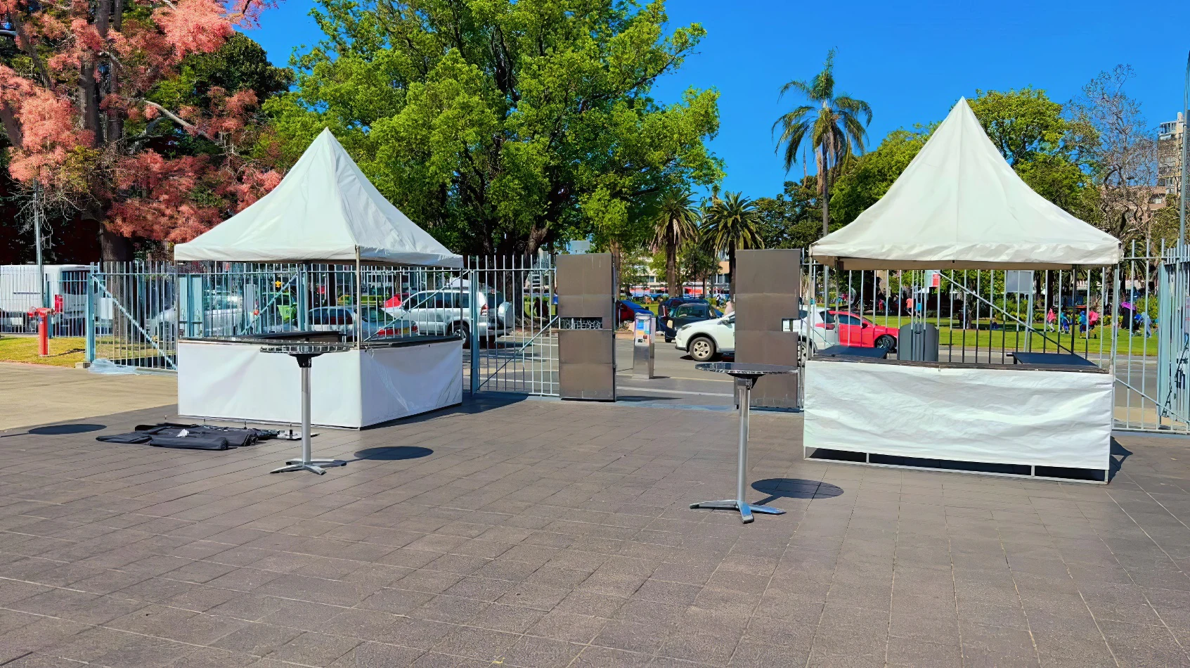 A white fete stall set up in a parking lot.