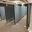 Freestanding partition panels arranged inside an indoor venue to create separated event and exhibition spaces