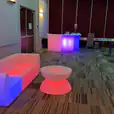 A vibrant Glow Corner with colorful furniture and a table.