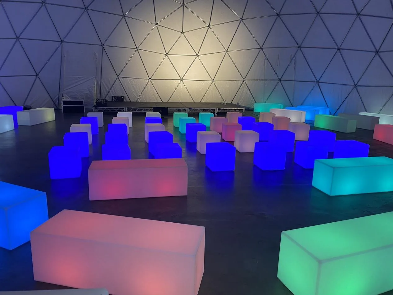 A dome filled with colorful glow cubes available for hire.