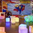 "Superman themed birthday party with Glow Cylinder seating hire.