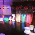 A birthday party with colorful balloons and coffee table hire.
