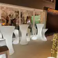 A group of glow stools and a bar with lights available for hire.