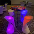 Glow stools and table in a conference room.