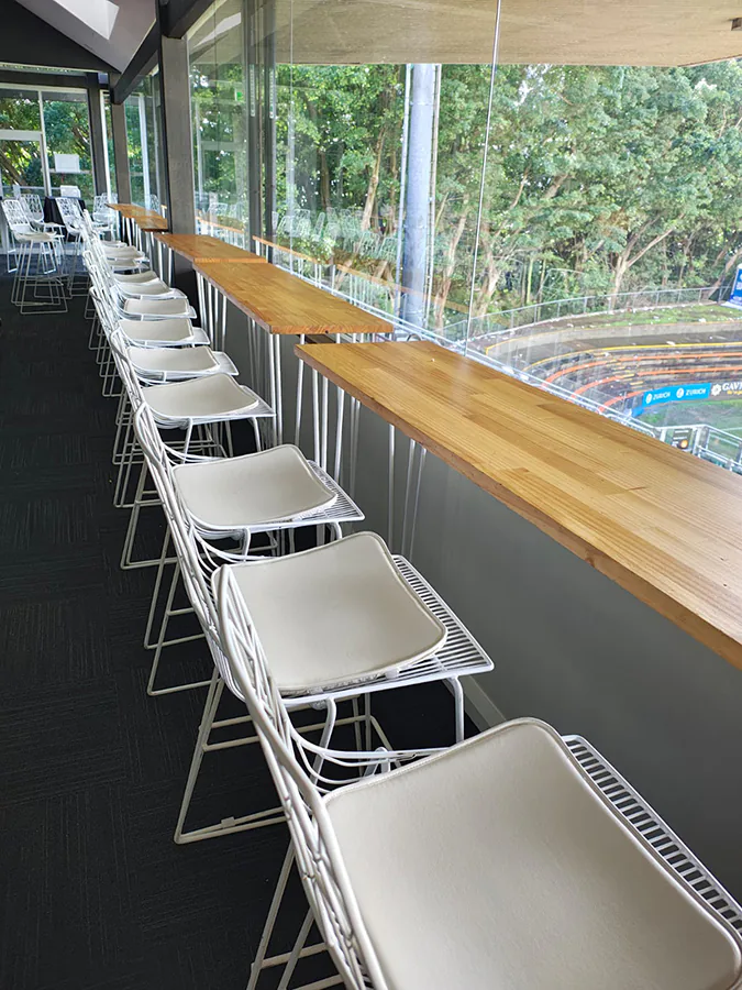 Hairpin timber top tables next door white wire stools