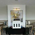Karaoke jukebox and speaker system setup inside a modern lounge and function room with booth seating and ambient lighting
