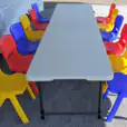 Kids Table Hire with a set of plastic chairs and a table in a tent.