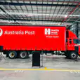 An Australian post truck is parked in a warehouse available for Lectern Hire.