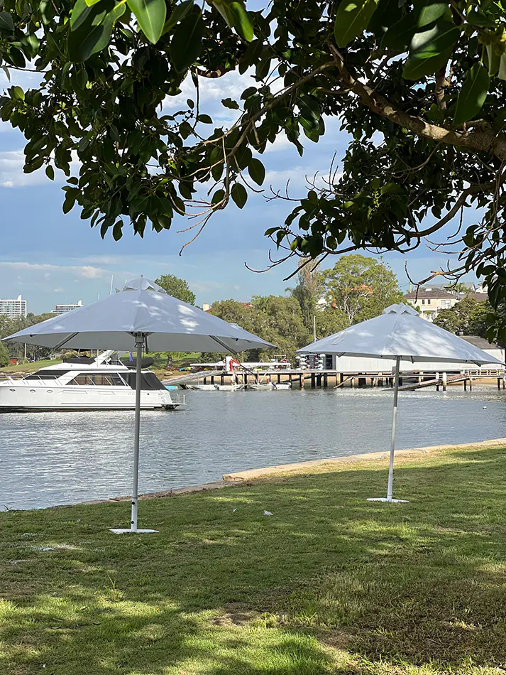 Market umbrellas on the edge of a lake providing shade