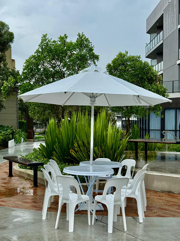 Market umbrellas in an outdoor corporate setting