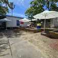Our market umbrellas being used in an outdoor stall area