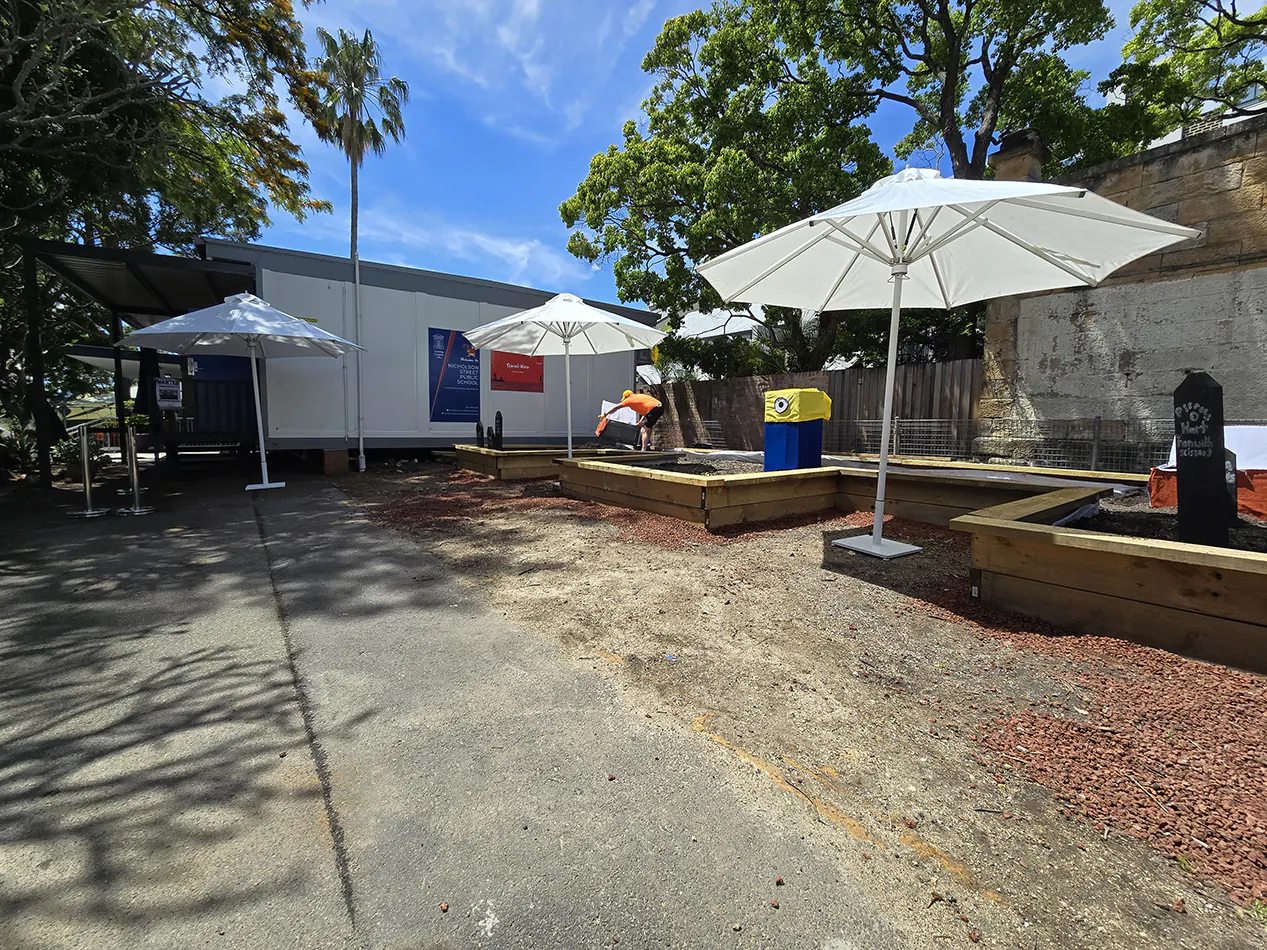 Our market umbrellas being used in an outdoor stall area