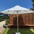 Our market umbrella near an outdoor lounge area