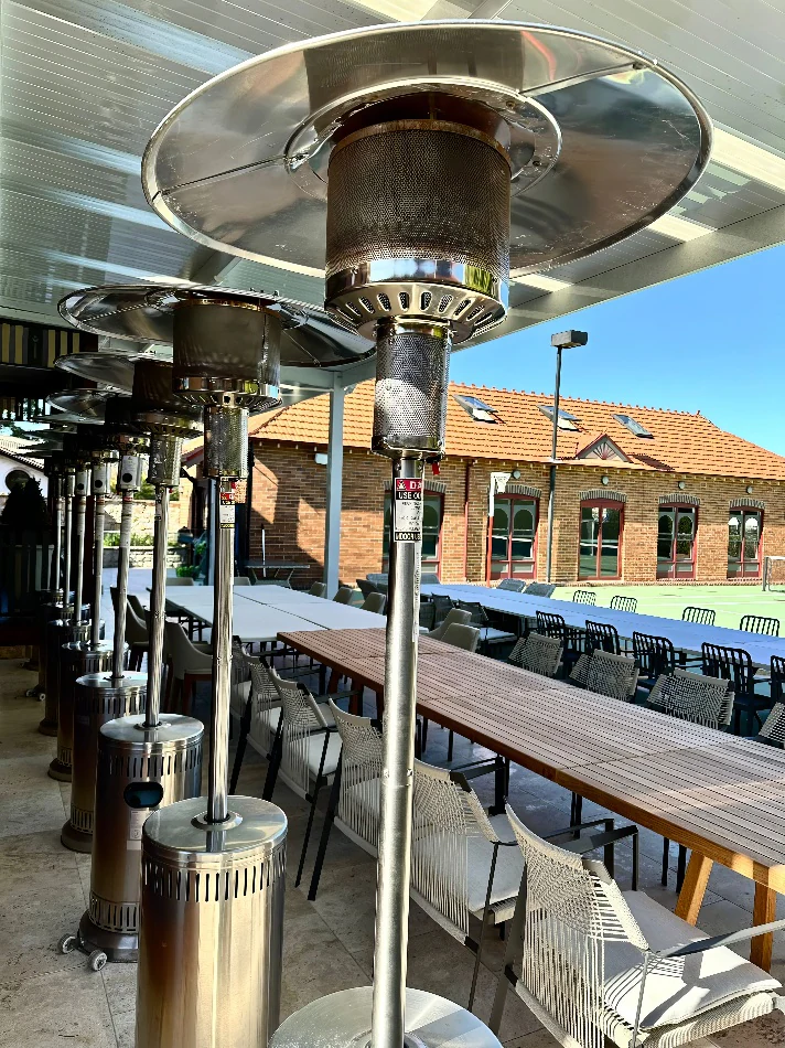 Mushroom heaters at an outdoor tennis club