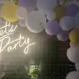 Neon Sign Hire for an Epic Let's Party with Balloon Arch