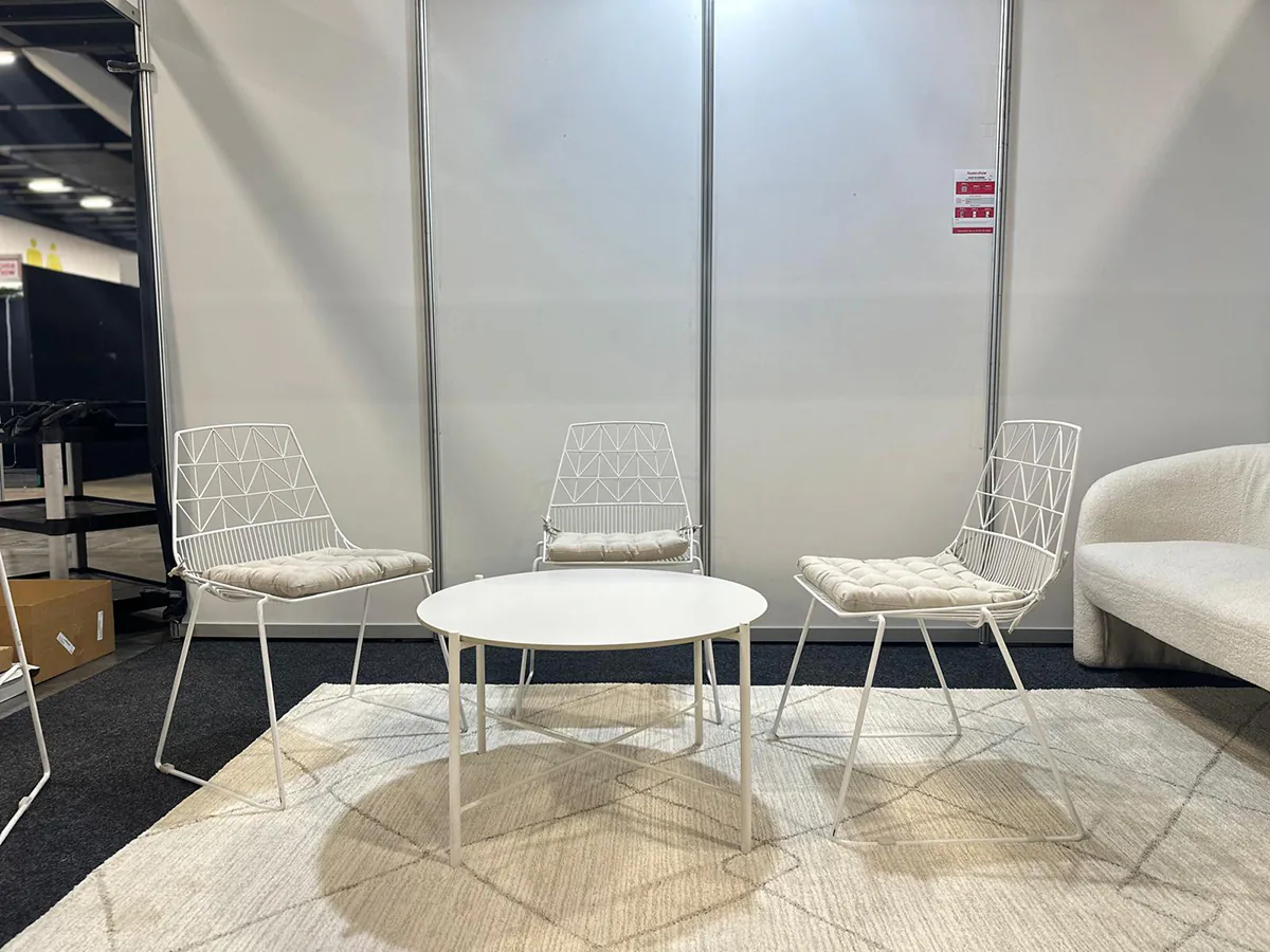 Our white cross coffee table with white wire chairs