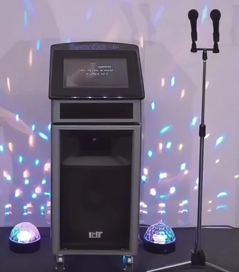 Pkg 2: A karaoke machine with lights, microphone, and Jukebox & Karaoke Hire.