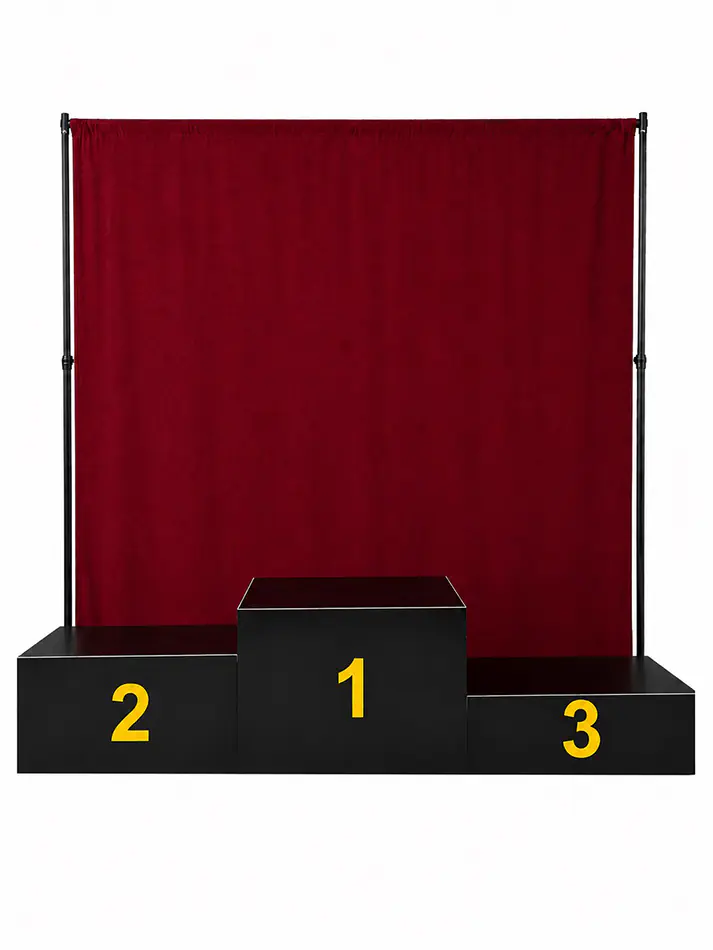 Red curtain draping with black winners podium blocks numbered one, two and three for an event or presentation display