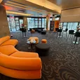 Sienna orange Apollo curved lounges arranged in an event seating area