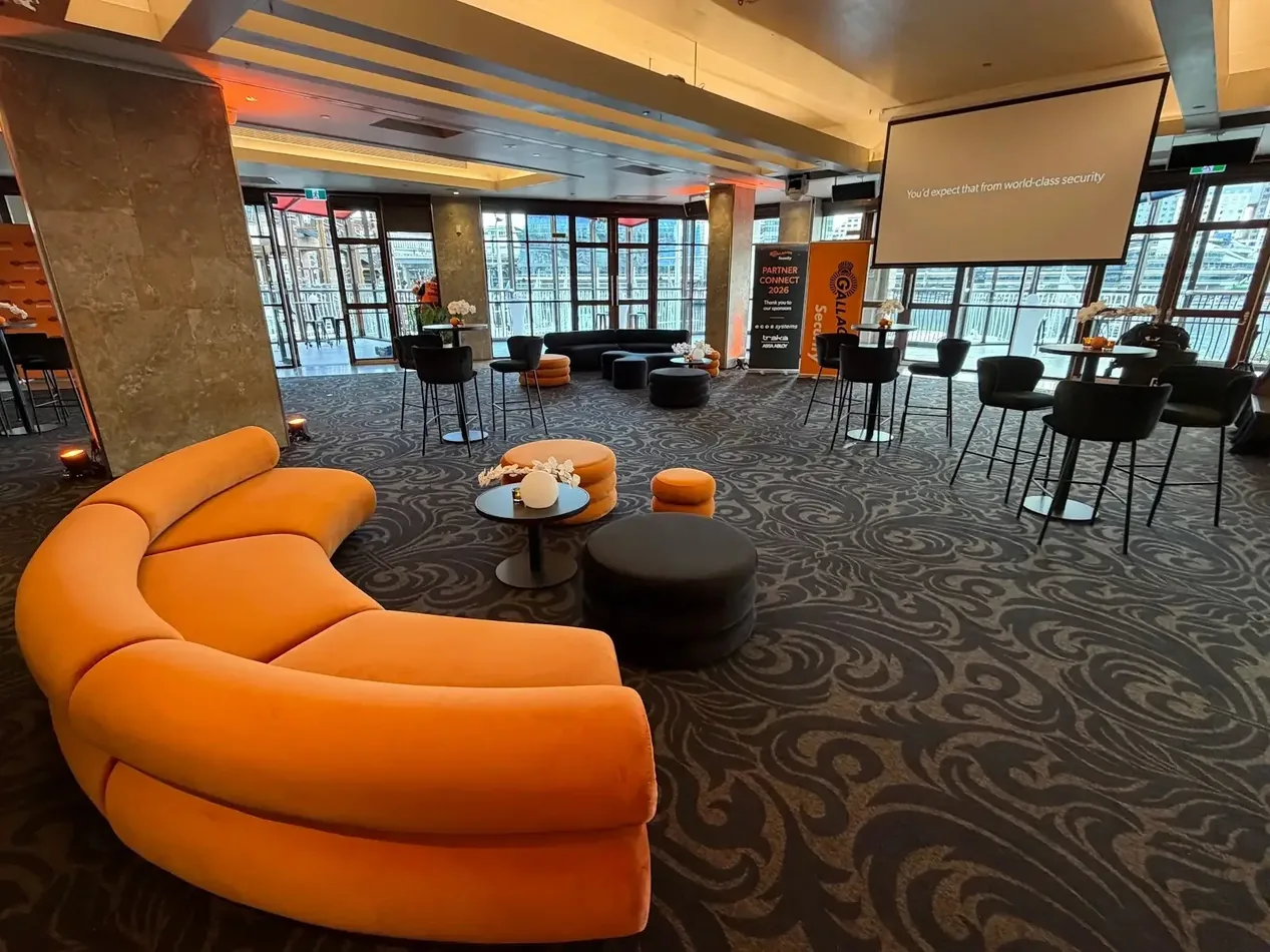 Sienna orange Apollo curved lounges arranged in an event seating area