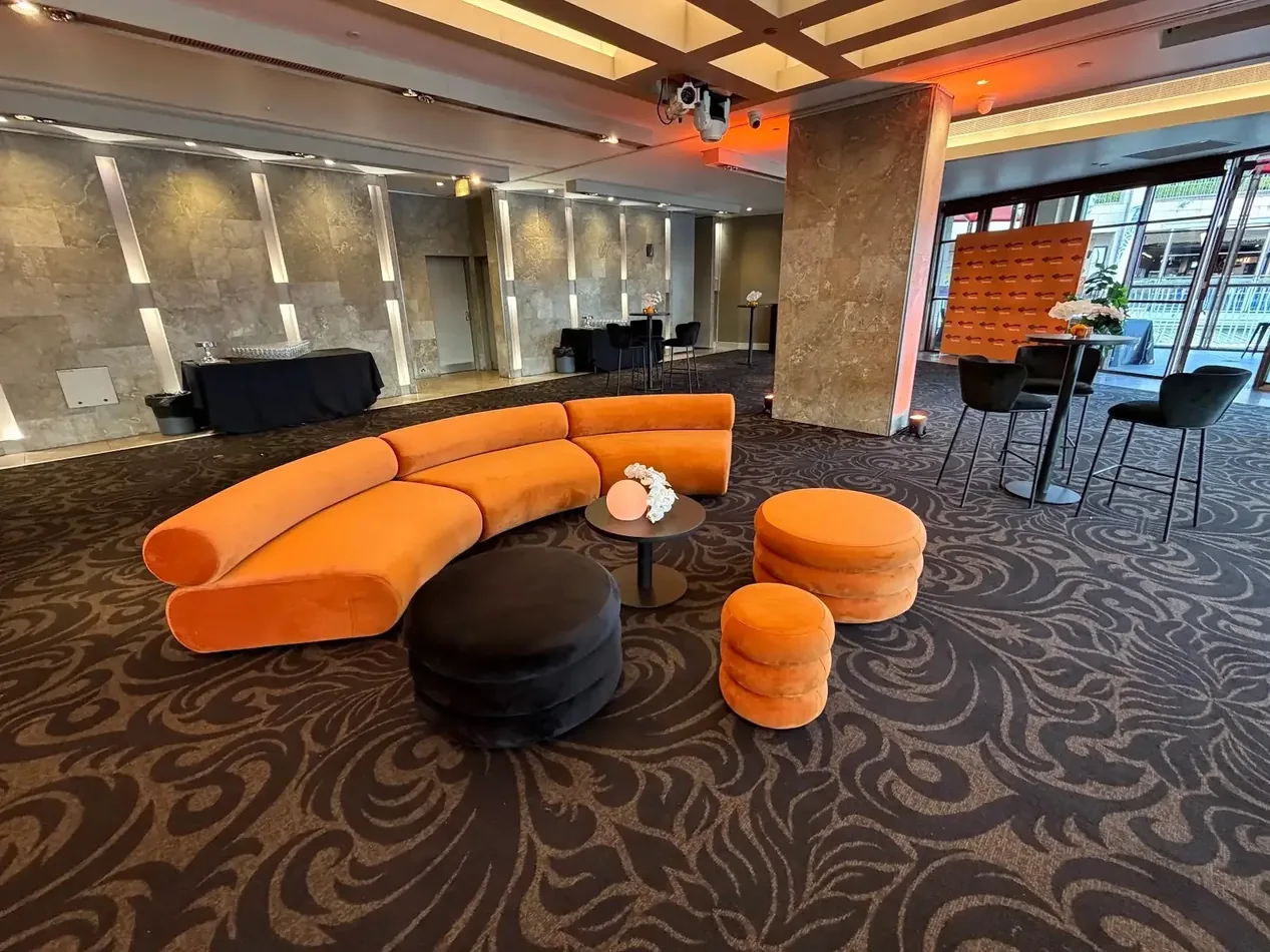 Sienna small and large ottomans with a black Atlas coffee table and Apollo lounge at an event