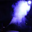 Smoke Machine Hire: A smoke machine is being used in a dark room.