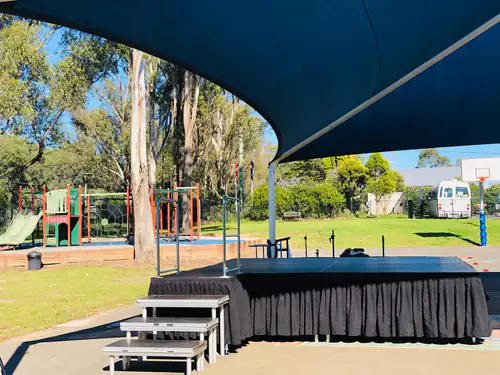 A stage set up for a party at a park
