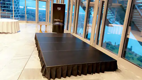A small stage set up for an event inside of the building